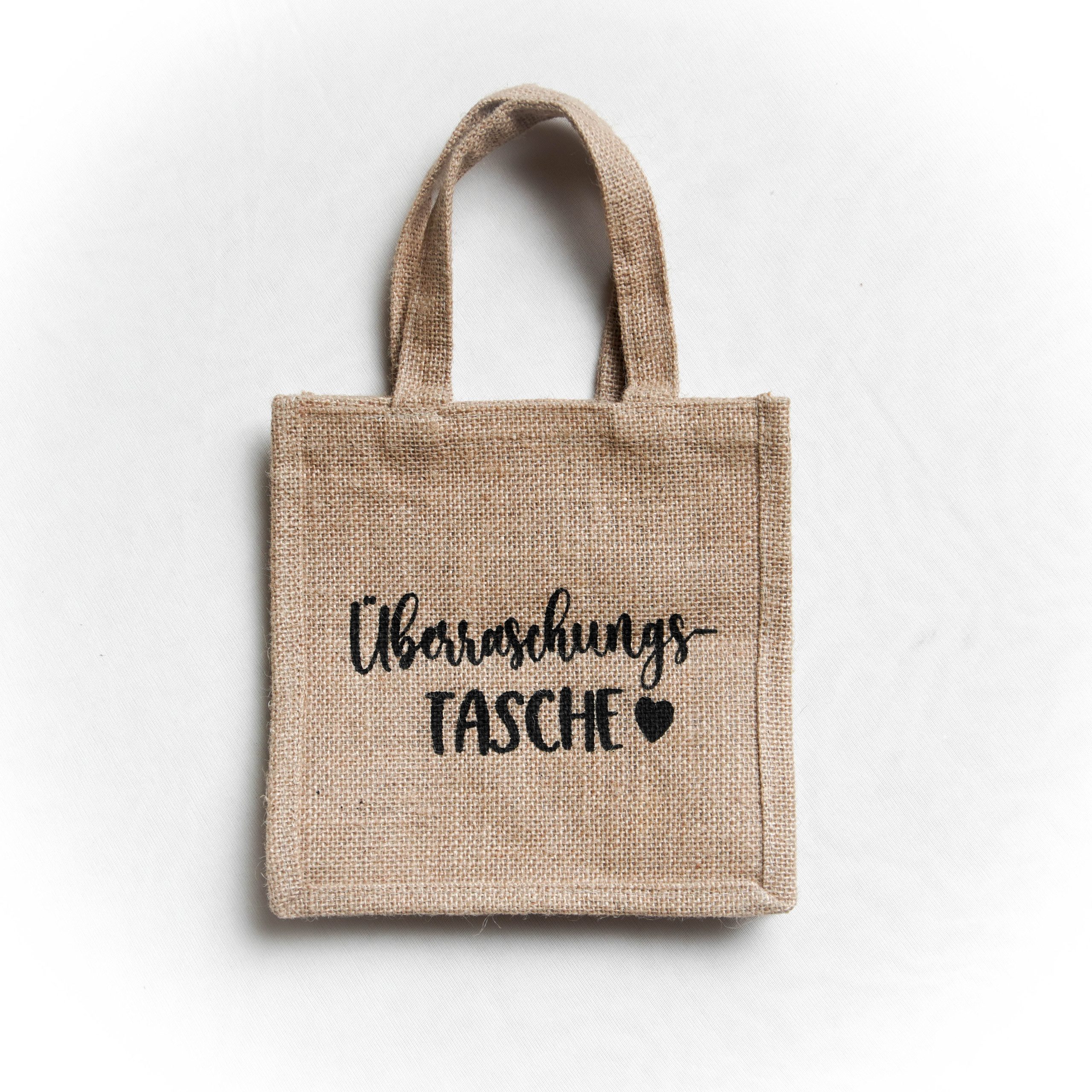 Jute bag with dark leather handles